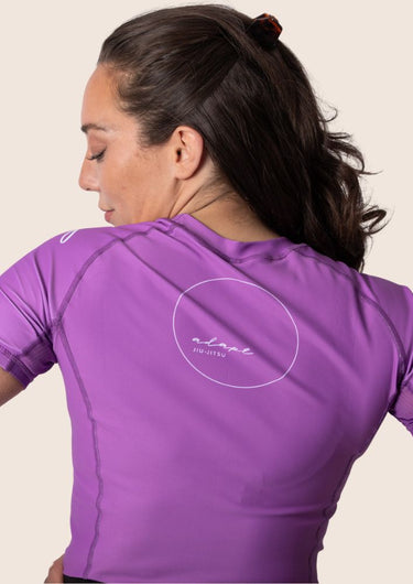 Women’s original BJJ rashguard in orchid purple, minimalistic design, 100% IBJJF legal. 