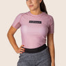 Women’s original BJJ rashguard in pink, featuring four‑way stretch and mesh ventilation. Unique womens fit. 