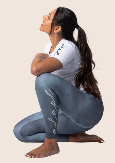 Women’s high‑waisted training leggings in onyx grey; matte finish; supportive compression.