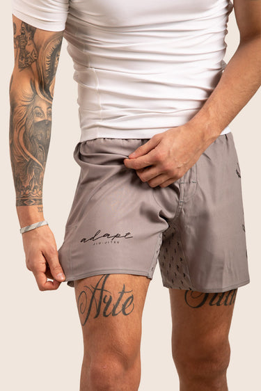 Unisex Jiu‑Jitsu training shorts in mid‑grey; lightweight construction with drawstring waistband.