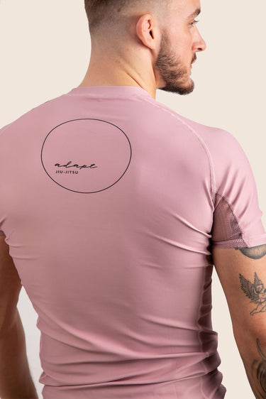 Men’s original BJJ rashguard in pink, minimalistic design.